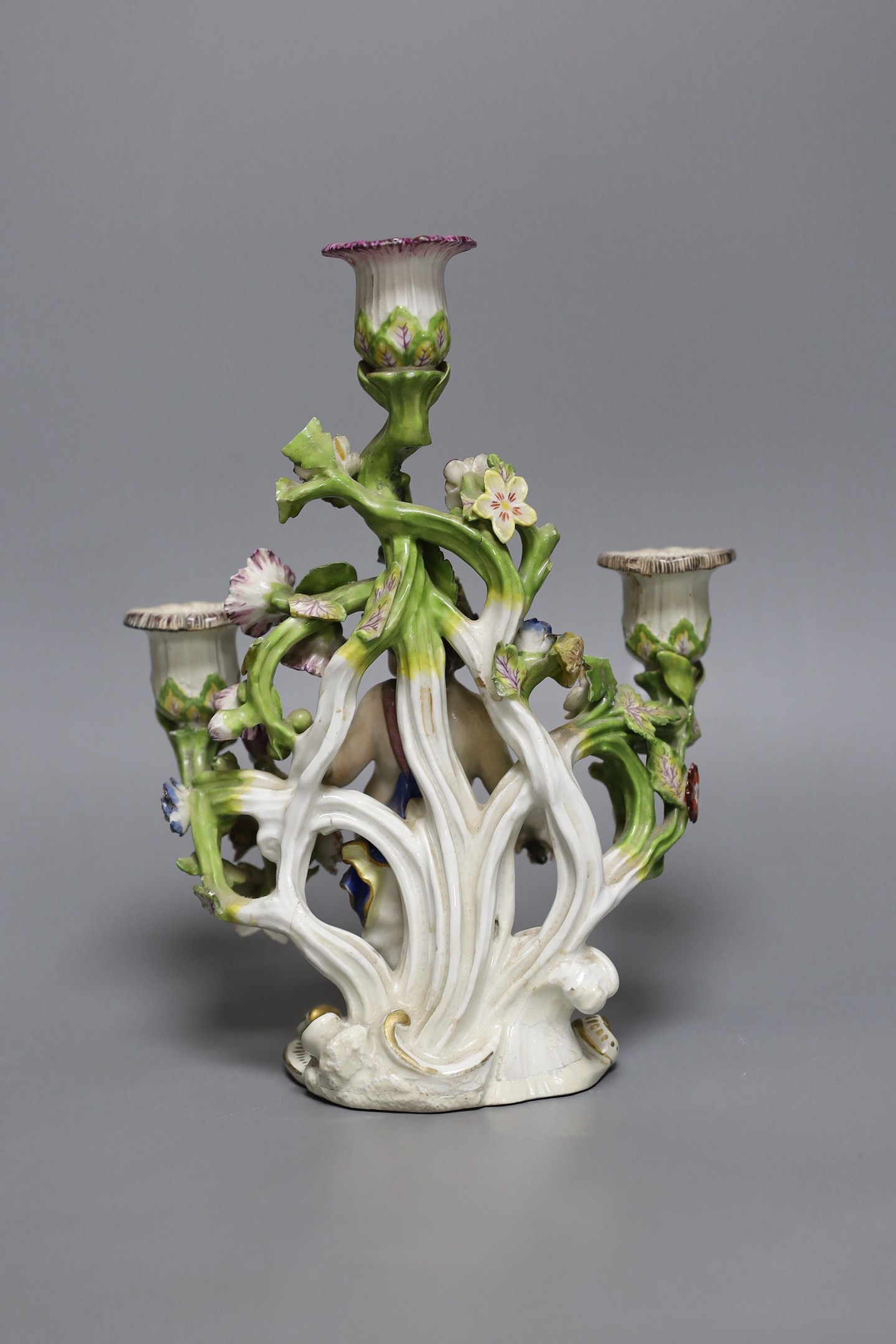 An 18th century English porcelain 3 branch candelabrum, probably Bow, 23cms high